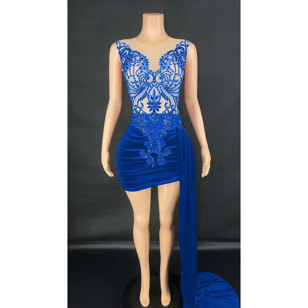 A royal blue velvet luxury evening dress with intricate lace detailing and a flowing side slit for elegant occasions