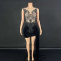 Black velvet luxury evening dress with lace detailing, beading, side slit, and a flowing train for formal occasions