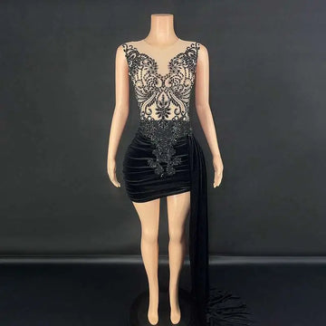 Black velvet luxury evening dress with lace detailing, beading, side slit, and a flowing train for formal occasions