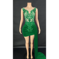 Emerald green velvet luxury evening dress with intricate lace detailing and a side slit for elegant occasions