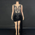Black velvet luxury evening dress with intricate black beaded lace detailing on the bodice and a side slit