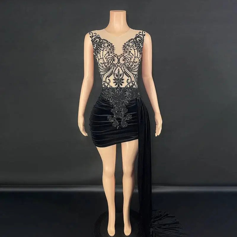 Black velvet luxury evening dress with intricate black beaded lace detailing on the bodice and a side slit
