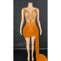 A vibrant orange velvet luxury evening dress with intricate gold beading and a side slit, featuring lace detailing