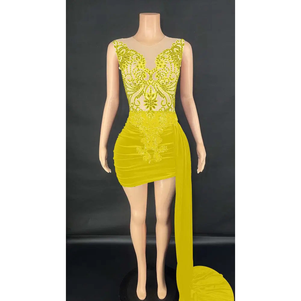 A luxury evening dress featuring vibrant yellow sequins, a sheer bodice, and a velvet luxury evening side train