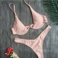 A delicate pink triangle bikini set with thin straps and ruffled edge in black velvet summer swimwear summer bikini style