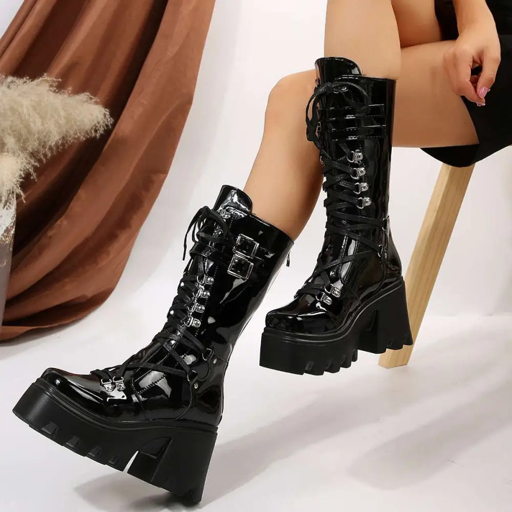 Black versatile casual leather platform boots with lace-up design, chunky soles, and silver metal buckles