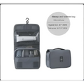Black wall mounted portable women makeup bag in gray oxford cloth with clear pockets, hanging hook, and top handle