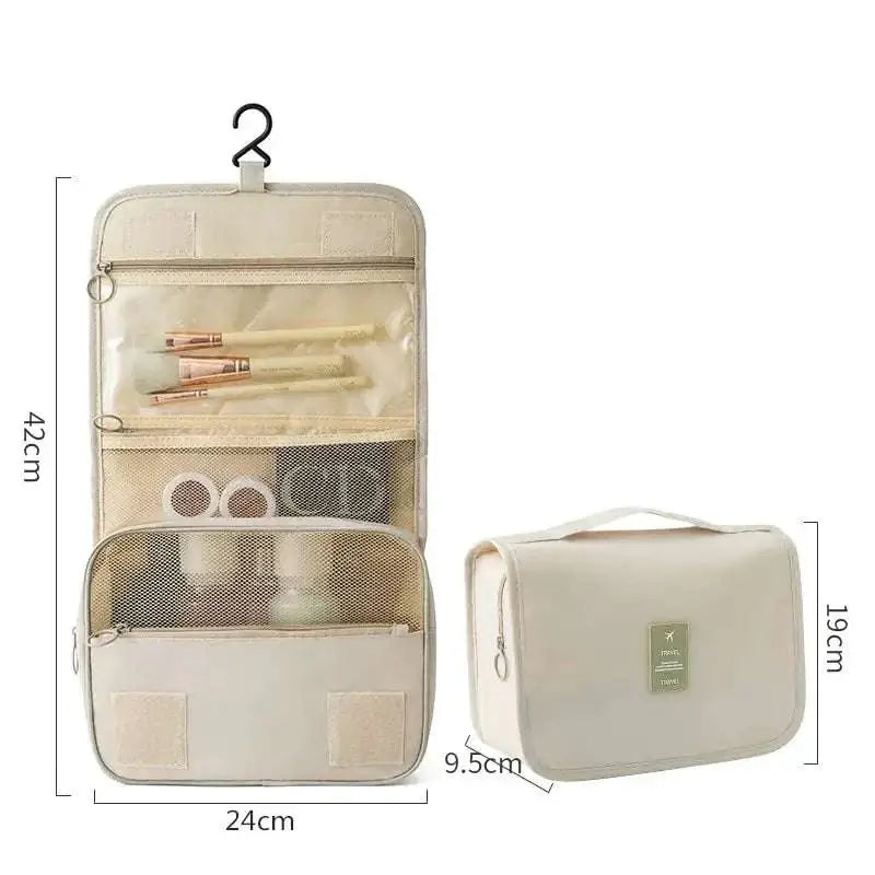 Beige travel toiletry organizer with mesh compartments and hanging hook for black wall mounted portable women makeup bag