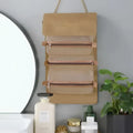 Beige canvas wall mounted portable women makeup organizer with three zippered compartments and gold-tone hardware