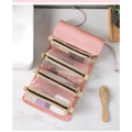 Pink roll-up travel organizer with clear zippered compartments and beige trim for portable women makeup storage