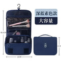 Black wall mounted portable women makeup bag in deep navy blue with clear front pocket and mesh compartments