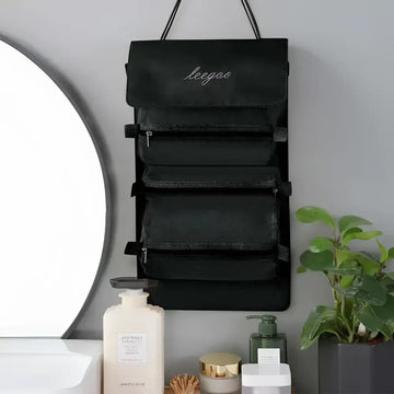 Black wall mounted portable women makeup bag with five zippered compartments and embroidered brand name