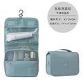 Light blue fabric toiletry bag with mesh compartments and hanging hook for black wall mounted portable women makeup bag