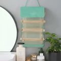 Mint green fabric wall mounted portable women makeup organizer with three transparent mesh compartments and wooden accents