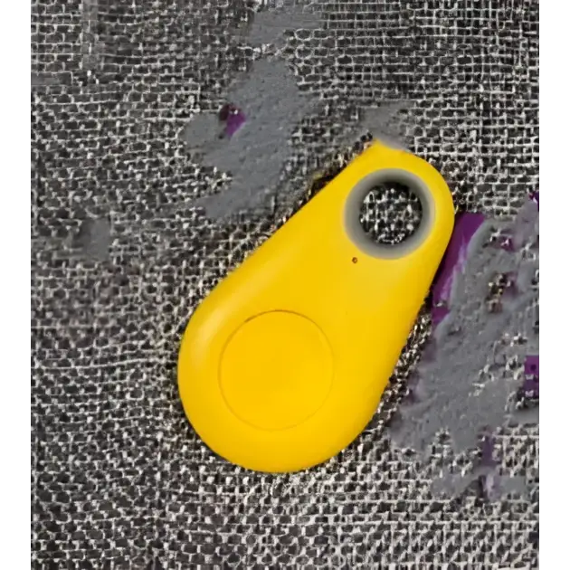 Bright yellow plastic key fob with button and hole for black water drop anti lost object lost object finder