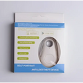 Silver oval-shaped black water drop anti lost object finder with circular button and camera lens in white and blue box