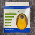 Yellow self-portrait bluetooth tracker with circular button and gray ring for black water drop anti lost object finder
