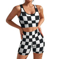 Black and white racing checkered yoga set with high waisted shorts and crop top featuring black trim