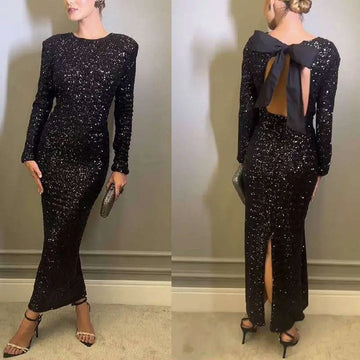 Black winter sexy backless sequined mermaid gown with long sleeves and back bow detail shown from the back side
