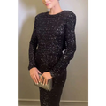 A shimmering black winter sexy backless sequined mermaid gown with a fitted silhouette and long sleeves