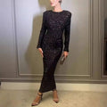 A black winter sexy backless sequined mermaid gown with long sleeves and a fitted midi silhouette