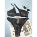 Black women bikini serpentine pattern set with snakeskin texture and gold-toned bone-shaped clasp detail