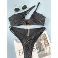 Black women bikini serpentine pattern set with snakeskin texture and gold-toned bone-shaped clasp hardware