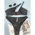 Black women bikini serpentine pattern set with snakeskin texture and gold-toned bone-shaped clasp hardware