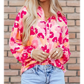 A vibrant pink and orange blooming floral print puff sleeve shirt with long sleeves and a lightweight fabric design
