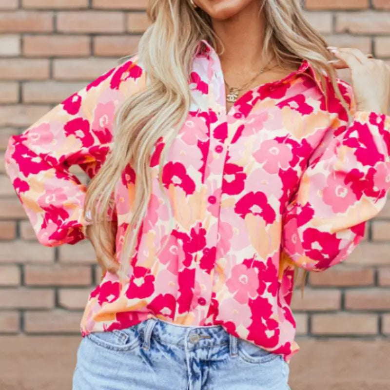 A vibrant pink blooming floral print puff sleeve long-sleeve blouse perfect for spring and summer wear