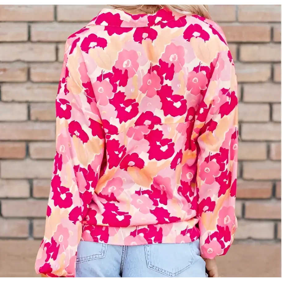 A blooming floral print long-sleeved hoodie with vibrant pink and peach colors and soft cozy fabric texture