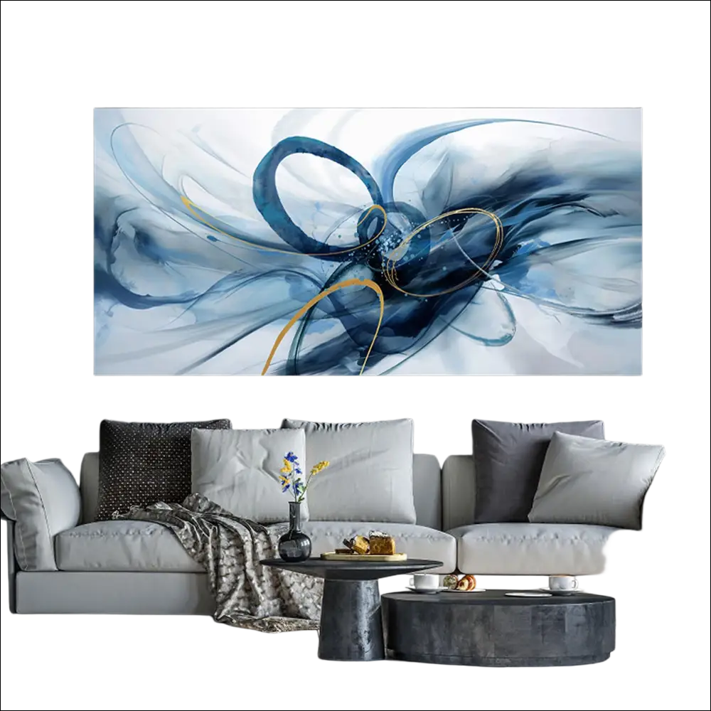 Blue and gold modern abstract wall art with swirling brushstrokes displayed above a gray sofa in a living room setting