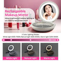 Rechargeable makeup mirror with silver round bag frame and mesh-lined interior in blue and silver round bag design