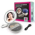 Silver circular led round bag mirror with mesh-lined blue carrying case and usb charging cable for travel use