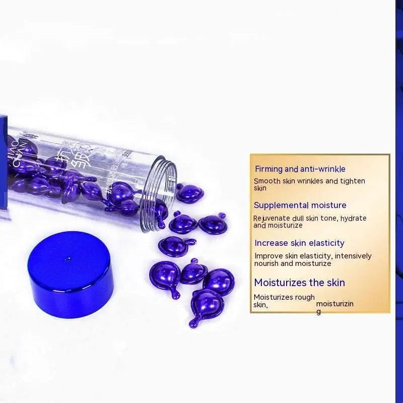 Purple gel-filled serum capsules spilling from a clear glass tube with blue cap in blue big chicken leg anti aging essence capsules