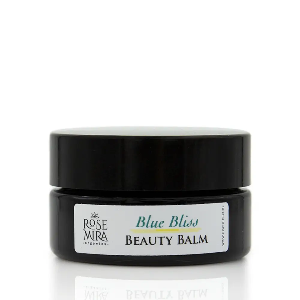 Black ceramic jar of rose mira organics blue bliss beauty balm for day and night soothing irritated skin