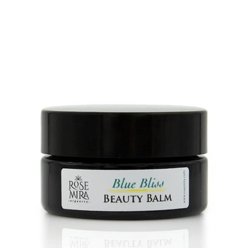 Black ceramic jar of rose mira organics blue bliss beauty balm for day and night soothing irritated skin
