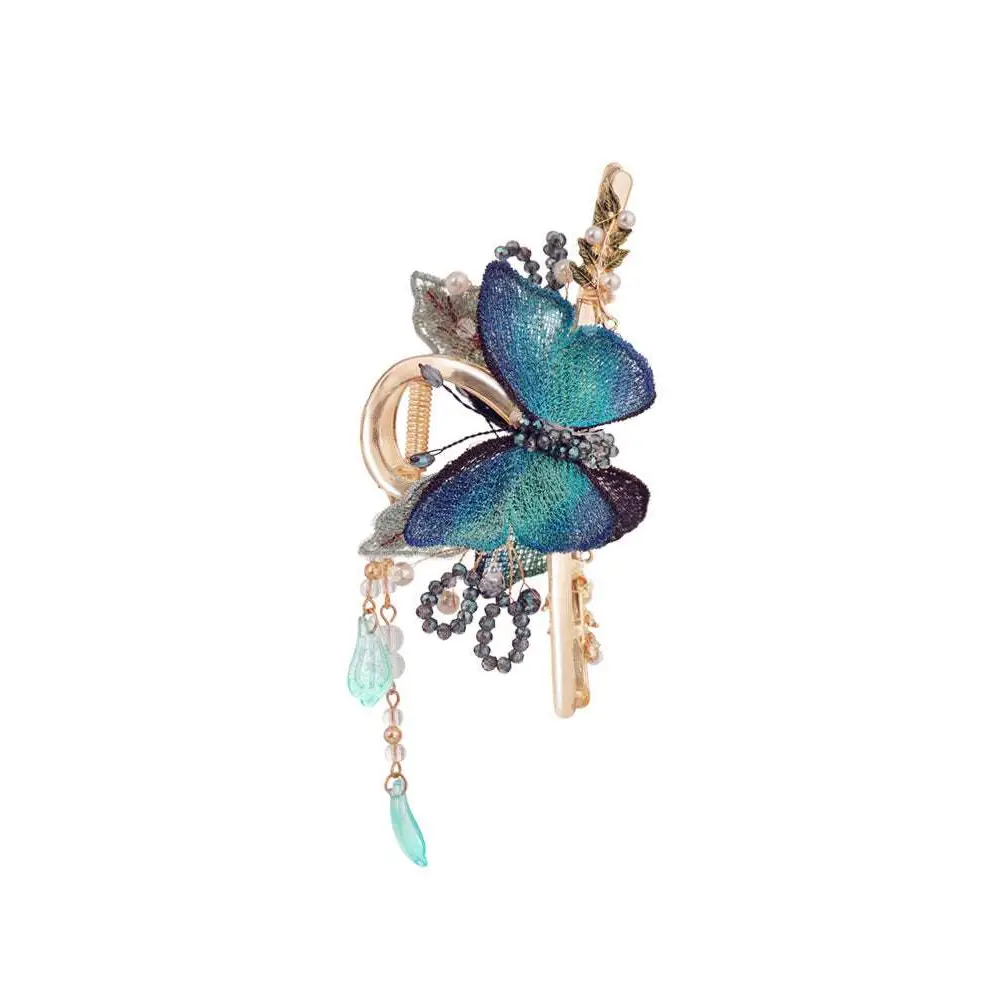 Blue butterfly mori style shark clip featuring delicate embroidery, pearls, beads, and teal teardrop charms