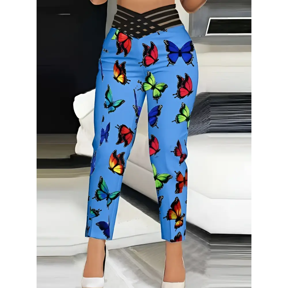 Blue butterfly slim fit pants featuring high-waisted slim fit design with black crisscross elastic waistband