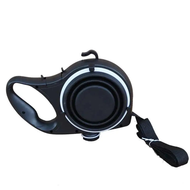 Black retractable dog leash with ergonomic handle and white accent rings paired with blue collapsible pet water bottle with pet rope
