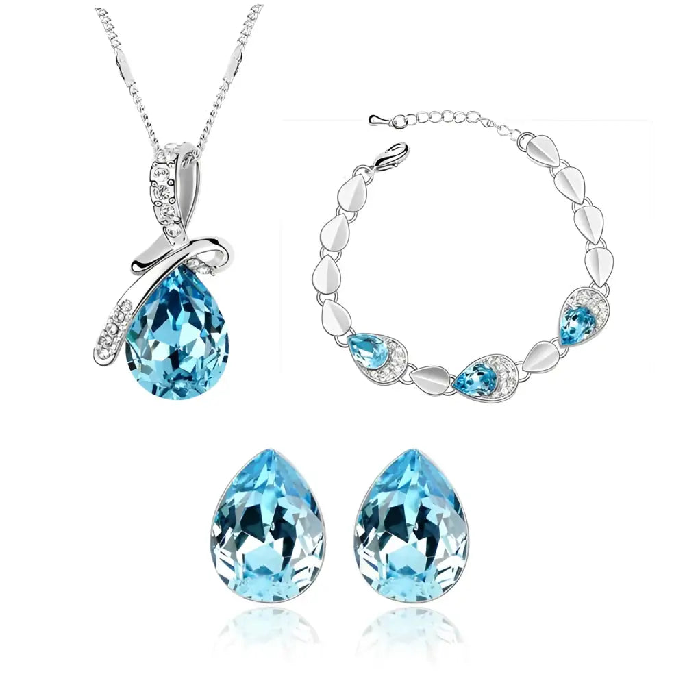 A silver-toned creative alloy necklace with a pear-shaped blue crystal pendant and clear crystal accents