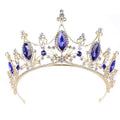 Golden headband adorned with large marquise blue gemstones and clear crystals for a crystal crown bride look