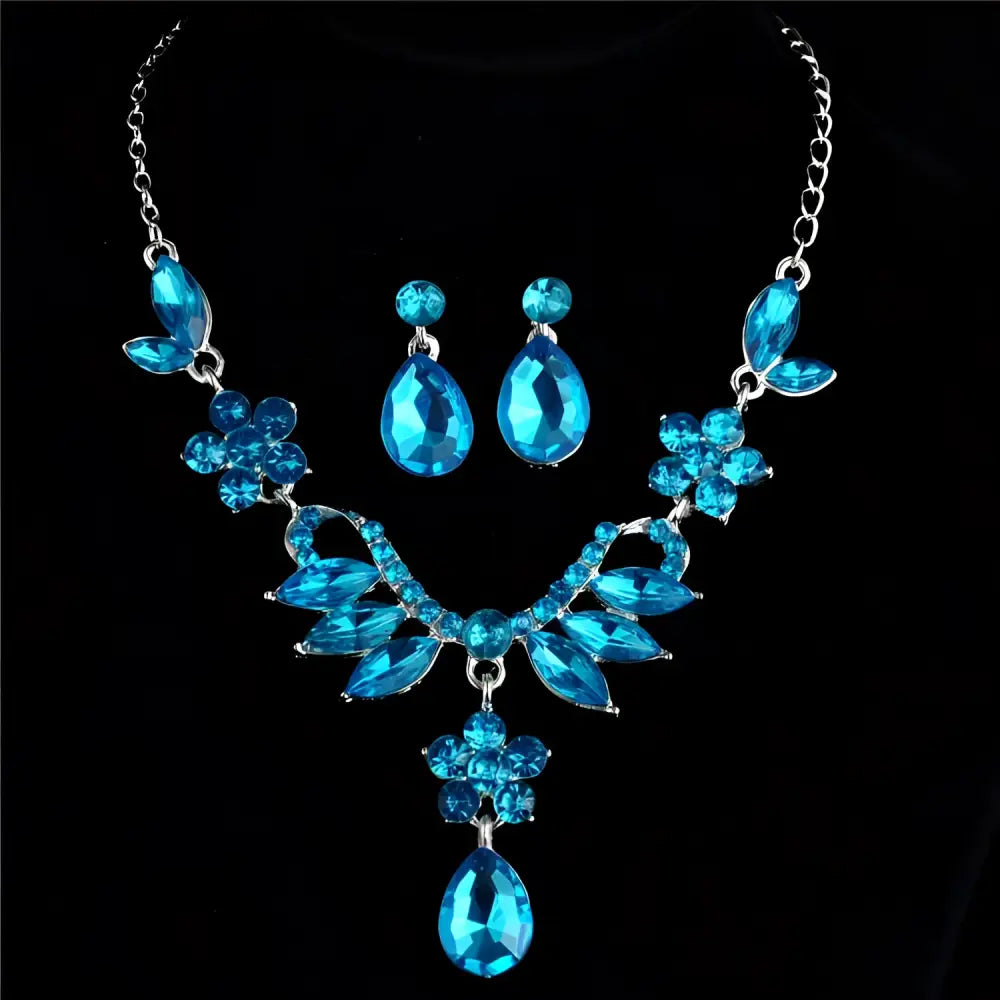 A blue crystal explosion bride alloy necklace with floral and teardrop designs accented by silver-toned chains