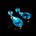 Elegant blue crystal explosion bride alloy earrings with teardrop shape and faceted crystal accents in silver setting