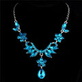 A sparkling blue crystal explosion bride alloy necklace with floral leaf motifs and a central teardrop pendant