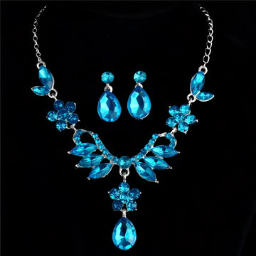 A blue crystal explosion bride alloy necklace featuring sparkling floral and teardrop designs with silver-toned chains