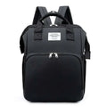 Black fabric backpack with silver zippers and white living traveling share label for blue denim large capacity mommy bag