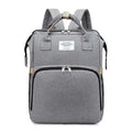 Gray textured fabric backpack with black zippers and beige trim designed as a blue denim large capacity mommy bag