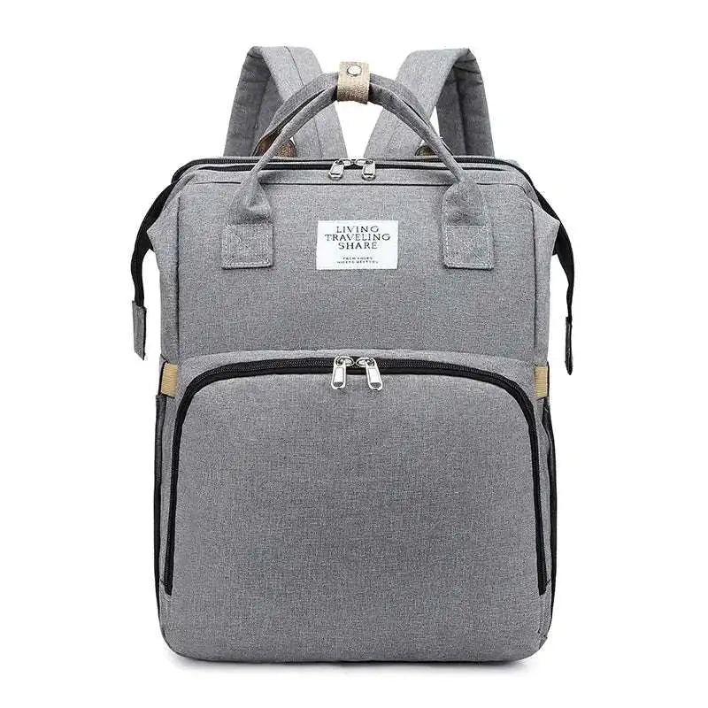 Gray textured fabric backpack with black zippers and beige trim designed as a blue denim large capacity mommy bag