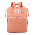 A coral fabric maternity backpack with beige zipper pulls and metallic accents for blue denim large capacity mommy bag